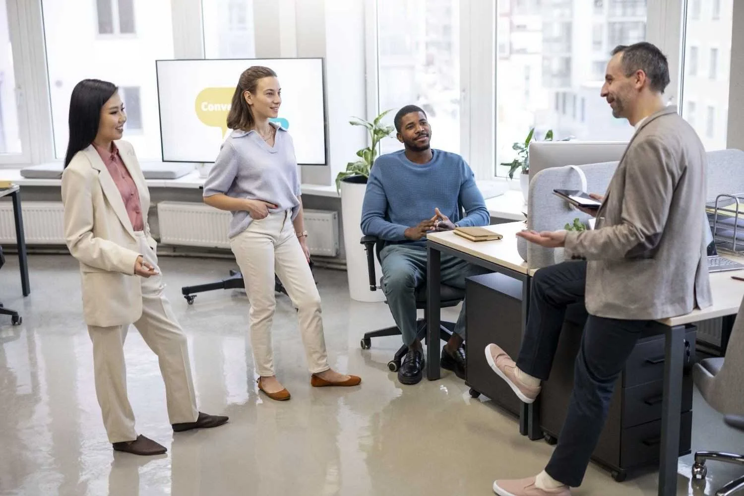 Professionals from diverse industries networking, representing collaboration and cross-industry hiring

