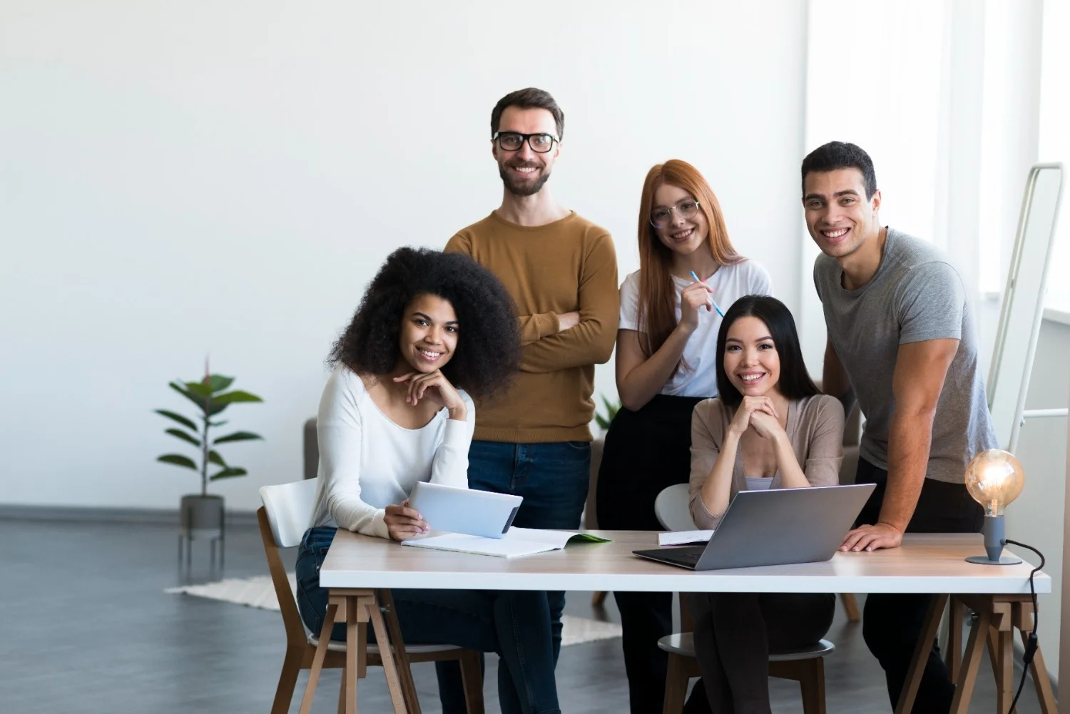 Professional recruitment team posing confidently, symbolizing industry-specific hiring solutions
