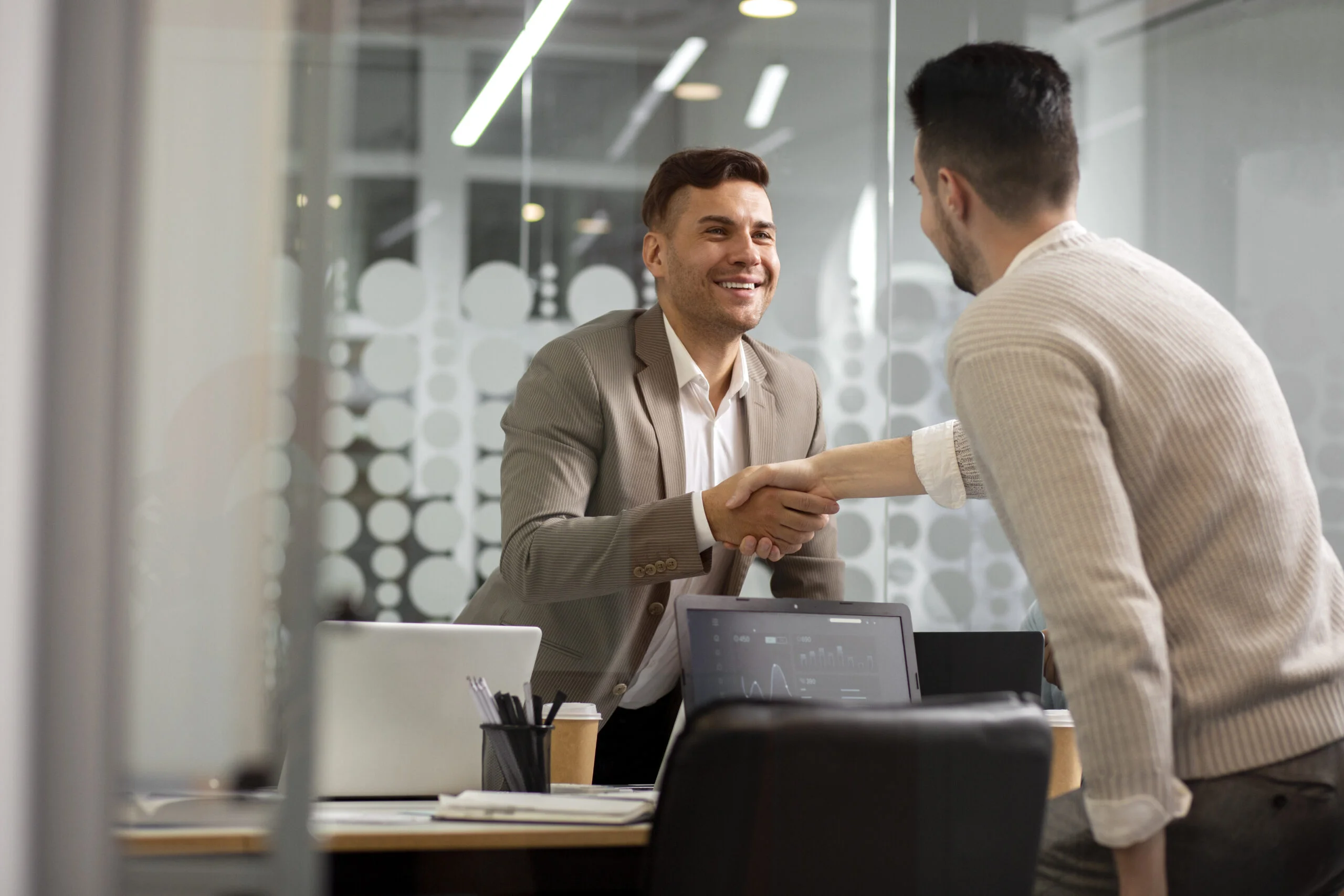 Happy job seeker shaking hands with a recruiter after successful placement in Pune